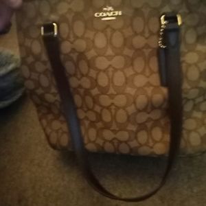 Two brown coach purses